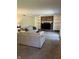 Comfortable living room showcasing a brick fireplace, built-in shelving, and access to the backyard at 7140 Avalon Trail Dr, Indianapolis, IN 46250