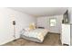 Serene primary bedroom featuring soft lighting, a comfortable bed, and ample closet space at 7140 Avalon Trail Dr, Indianapolis, IN 46250