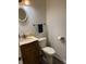 Compact powder room with a stylish vanity and updated fixtures at 7140 Avalon Trail Dr, Indianapolis, IN 46250