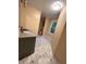 This bathroom features a granite vanity with sink and tile flooring at 728 W 300 N, Anderson, IN 46011