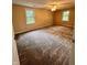 Spacious bedroom features neutral walls, plush carpeting, and two windows for natural light at 728 W 300 N, Anderson, IN 46011