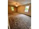 Spacious bedroom features neutral walls, plush carpeting, and two windows for natural light at 728 W 300 N, Anderson, IN 46011