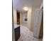 Well-lit hallway featuring stylish flooring and neutral paint at 728 W 300 N, Anderson, IN 46011