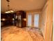 Spacious kitchen features stainless steel appliances, dark wood cabinets, and tile floors at 728 W 300 N, Anderson, IN 46011