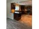 This kitchen features wood cabinets, modern appliances, stone countertops and decorative backsplash at 728 W 300 N, Anderson, IN 46011