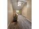 Upstairs landing with vaulted ceiling, skylight, and a ceiling fan above the stairway at 728 W 300 N, Anderson, IN 46011