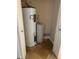 A closet featuring a hot water tank and water filtration system at 728 W 300 N, Anderson, IN 46011