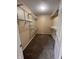 This walk-in closet features neutral walls, carpeted floor, and organized wire shelving at 728 W 300 N, Anderson, IN 46011