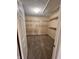 Spacious walk-in closet featuring neutral walls, carpeted floor, and organized wire shelving at 728 W 300 N, Anderson, IN 46011