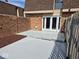 Backyard with a fenced-in yard, a wooden deck, and brick fencing for privacy at 7368 Country Brook Dr # 7368, Indianapolis, IN 46260