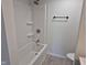 Bathroom with a white shower and tub, bright walls, and updated fixtures at 7368 Country Brook Dr # 7368, Indianapolis, IN 46260