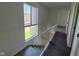 Upstairs hallway features a carpeted floor and natural light from window at 7368 Country Brook Dr # 7368, Indianapolis, IN 46260