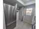 Modern kitchen with stainless steel appliances and updated gray cabinets at 7368 Country Brook Dr # 7368, Indianapolis, IN 46260