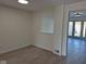 Cozy room featuring modern flooring, neutral paint, and a window overlooking the living room at 7368 Country Brook Dr # 7368, Indianapolis, IN 46260
