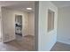 Bright living room featuring modern flooring, neutral paint, and an open layout to the kitchen at 7368 Country Brook Dr # 7368, Indianapolis, IN 46260