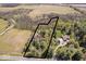 Expansive acreage with mature trees highlights the home's secluded setting at 7425 E 300 S, Whitestown, IN 46075