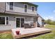 Backyard deck with seating area and stainless steel grill overlooking a well-maintained lawn at 7425 E 300 S, Whitestown, IN 46075