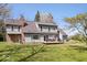 Spacious backyard with lush green grass, mature trees, and an outdoor deck area at 7425 E 300 S, Whitestown, IN 46075