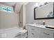 Cozy bathroom with a tub, white marble vanity, and unique details at 7425 E 300 S, Whitestown, IN 46075