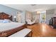 A primary bedroom featuring a sitting area with a fireplace and parquet floors, and neutral paint at 7425 E 300 S, Whitestown, IN 46075