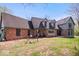 Attractive exterior features brick and siding, a large yard, and mature landscaping at 7425 E 300 S, Whitestown, IN 46075