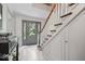 Welcoming foyer with staircase, tiled flooring, and a view of the front entrance at 7425 E 300 S, Whitestown, IN 46075