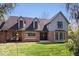Charming two-story home with a brick facade, dormer windows, and a well-manicured lawn at 7425 E 300 S, Whitestown, IN 46075
