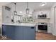 Beautiful kitchen with pendant lights, stainless steel appliances, and an island at 7425 E 300 S, Whitestown, IN 46075