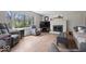 Bright living room with hardwood floors, a fireplace, and a view of the outdoors at 7425 E 300 S, Whitestown, IN 46075