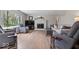 Bright living room with hardwood floors, a fireplace, and a view of the outdoors at 7425 E 300 S, Whitestown, IN 46075
