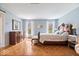 Spacious main bedroom with hardwood floors, two windows, and a classic style at 7425 E 300 S, Whitestown, IN 46075