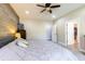 This primary bedroom features a king bed, carpeted floor, and opens to a walk-in closet at 8188 Spring Valley Dr, Plainfield, IN 46168