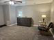 Bonus room featuring carpet flooring, a ceiling fan, Murphy bed and a seating area at 8188 Spring Valley Dr, Plainfield, IN 46168