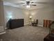 Bonus room with ceiling fan, neutral paint and carpeting and a Murphy bed at 8188 Spring Valley Dr, Plainfield, IN 46168