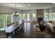 Bright dining area with a large table, windows, and access to the backyard at 8188 Spring Valley Dr, Plainfield, IN 46168