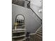 Entryway featuring a staircase with a wrought iron railing and a decorative table at 8188 Spring Valley Dr, Plainfield, IN 46168