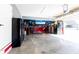 Spacious garage with a car lift and plenty of room for storage or hobbies at 8188 Spring Valley Dr, Plainfield, IN 46168
