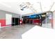 Spacious garage featuring a car lift, ample storage cabinets, and a clean, organized layout at 8188 Spring Valley Dr, Plainfield, IN 46168