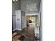 Hallway with views of the living area and views of the backyard through a large window at 8188 Spring Valley Dr, Plainfield, IN 46168