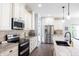 Close-up view of the stylish kitchen with stainless steel appliances and white cabinets at 8188 Spring Valley Dr, Plainfield, IN 46168