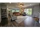 Open concept living room with access to kitchen and views of backyard at 8188 Spring Valley Dr, Plainfield, IN 46168