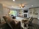 Cozy living room with a fireplace, large window with views and built in shelving at 8188 Spring Valley Dr, Plainfield, IN 46168