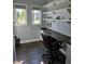 Home office with built-in desk, shelving, and natural light at 8188 Spring Valley Dr, Plainfield, IN 46168