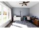 Sun-filled office features hardwood floors, large window, and a cozy work space at 8188 Spring Valley Dr, Plainfield, IN 46168