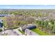 Aerial view of the townhome community, surrounded by lush greenery and trees at 9014 Ramapo Dr, Fishers, IN 46038