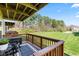 Cozy back deck featuring wood railings, a comfortable seating area, and a scenic view of the lush lawn at 9014 Ramapo Dr, Fishers, IN 46038