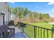 Relaxing balcony with outdoor seating overlooks a landscaped green space at 9014 Ramapo Dr, Fishers, IN 46038