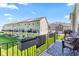 Community view from a charming balcony with outdoor seating and a blue outdoor rug at 9014 Ramapo Dr, Fishers, IN 46038