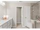 Bright bathroom featuring a vanity with storage and a glass shower enclosure at 9014 Ramapo Dr, Fishers, IN 46038