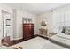 Bedroom featuring hardwood floors, a dresser, and a queen sized bed at 9014 Ramapo Dr, Fishers, IN 46038